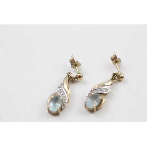 82 - 9ct gold blue topaz & diamond drop earrings with scroll backs (1.8g)