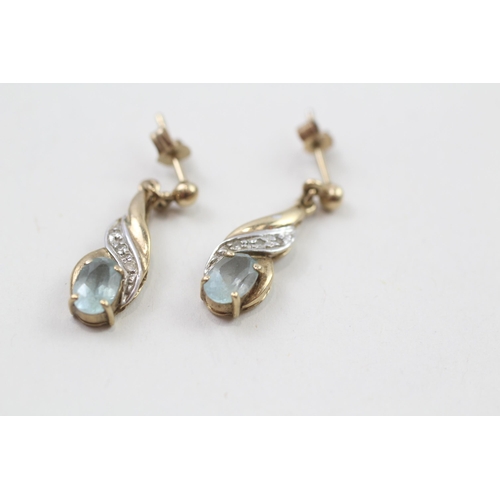 82 - 9ct gold blue topaz & diamond drop earrings with scroll backs (1.8g)