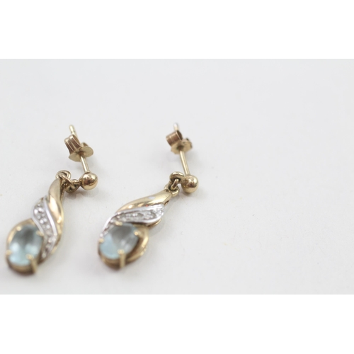 82 - 9ct gold blue topaz & diamond drop earrings with scroll backs (1.8g)