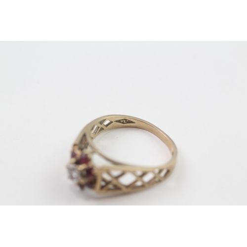 86 - 9ct gold 1970's ruby & diamond cluster ring with pierced patterned shoulders (2.5g) Size  N