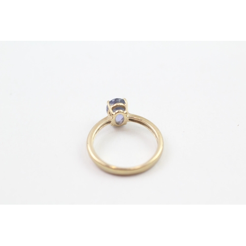 89 - 9ct gold oval cut tanzanite solitaire ring, claw set (2g) Size  J