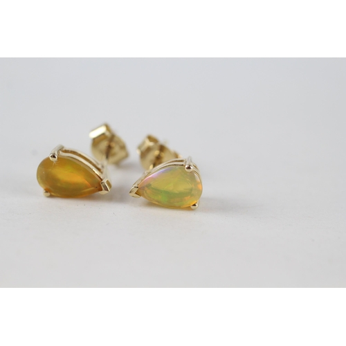 90 - 10ct gold pear cut opal stud earrings with scroll backs (1.5g)