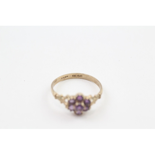 92 - 9ct gold amethyst cluster ring with patterned shoulders, Hallmarked Edinburgh 1994 (1.4g) Size  M