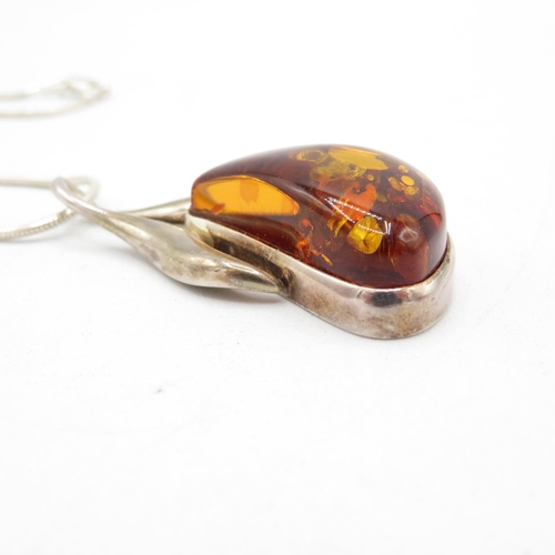 395 - Hallmarked 925 silver and amber necklace and chain, chain measures 45cm, pendant measures 5cm (20.8g... 