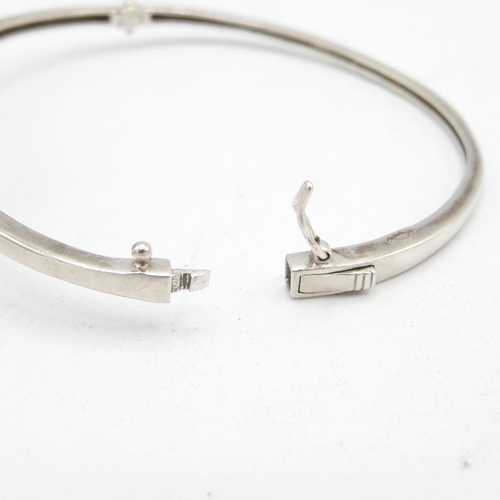 407 - 2x hallmarked silver bracelets - one with silver enamel and one with white gemstone tree (28.8g)