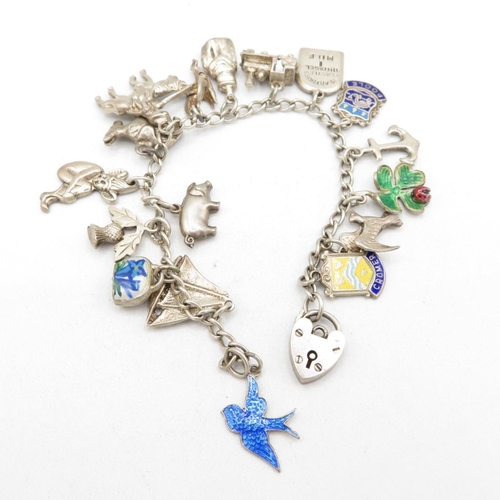 408 - Silver charm bracelet (34g)