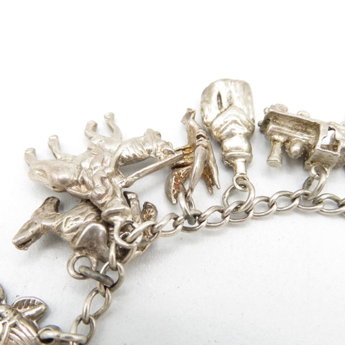 408 - Silver charm bracelet (34g)