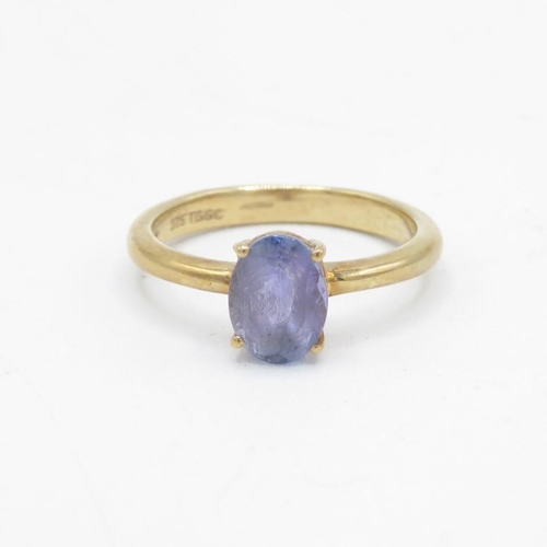 89 - 9ct gold oval cut tanzanite solitaire ring, claw set (2g) Size  J