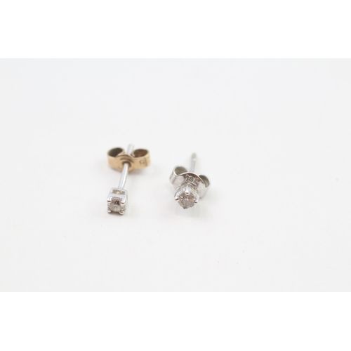 126 - 9ct gold diamond stud earrings with scroll backs (0.9g)