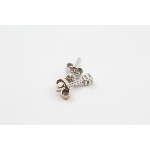 126 - 9ct gold diamond stud earrings with scroll backs (0.9g)