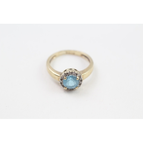 127 - 9ct gold blue topaz & diamond halo ring, claw set (2.1g) Size  J