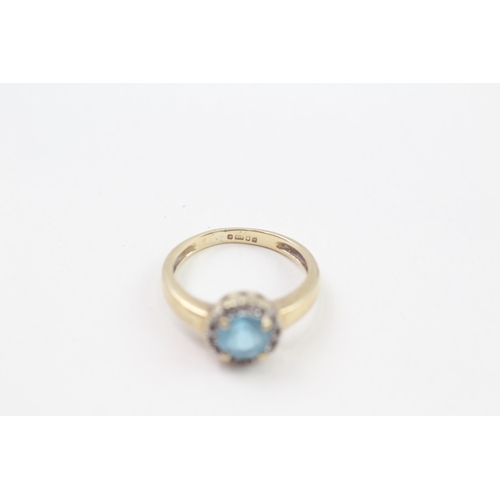 127 - 9ct gold blue topaz & diamond halo ring, claw set (2.1g) Size  J