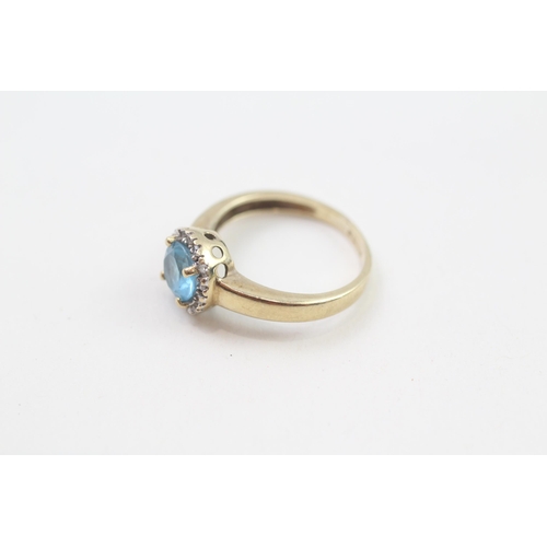 127 - 9ct gold blue topaz & diamond halo ring, claw set (2.1g) Size  J