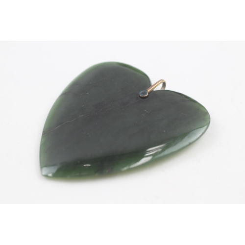 129 - 9ct gold bail nephrite heart pendant (34g)