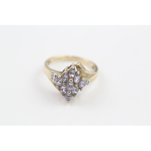 13 - 9ct gold marquise cut tanzanite & diamond dress ring (2.4g) Size  K