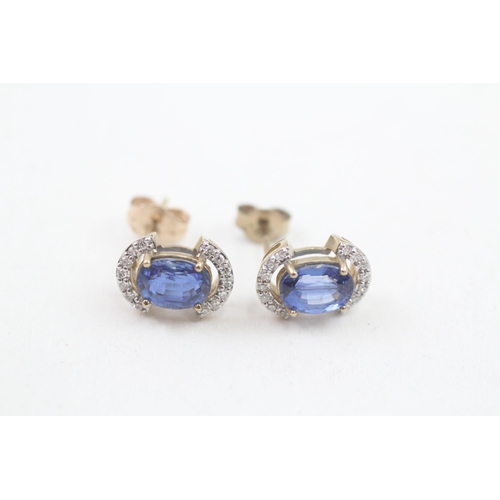 131 - 9ct gold diamond and sapphire stud earrings (2.1g)