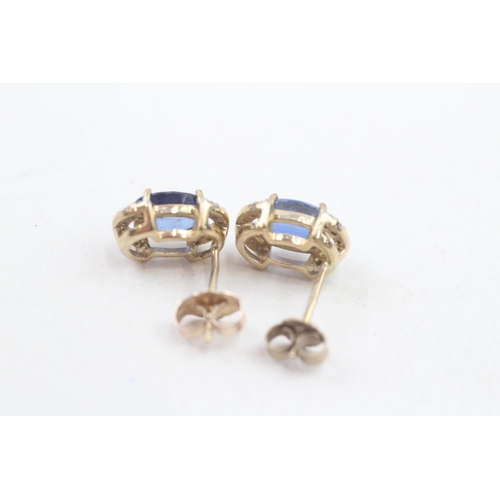 131 - 9ct gold diamond and sapphire stud earrings (2.1g)