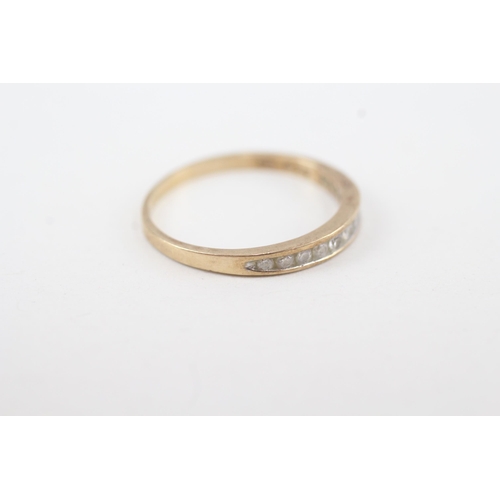 137 - 9ct gold channel set diamond ring (1.4g) Size P 1/2