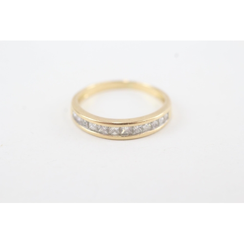 140 - 18ct gold channel set diamond ring (2.3g) Size M