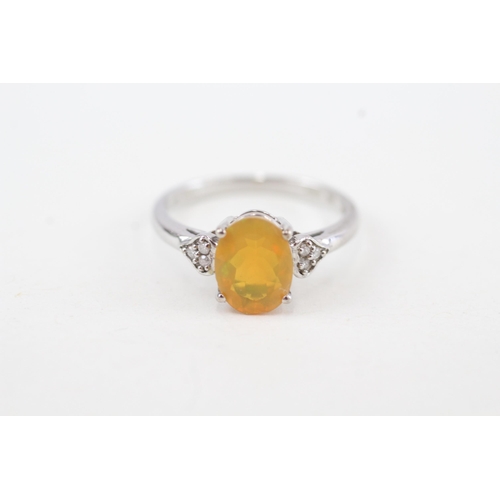 144 - 9ct gold opal and diamond dress ring (2.2g) Size N 1/2