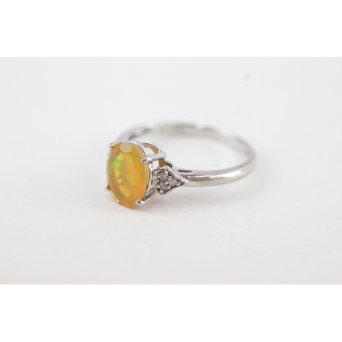 144 - 9ct gold opal and diamond dress ring (2.2g) Size N 1/2