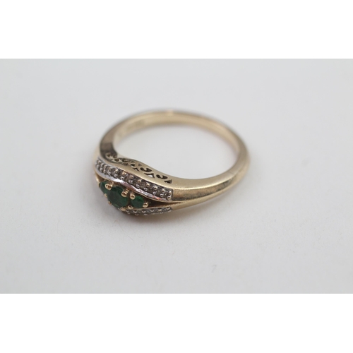 175 - 9ct gold diamond and emerald dress ring (3.8g) Size O