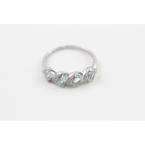 205 - 9ct white gold pear cut blue topaz & diamond half eternity ring (2.4g) Size  Q