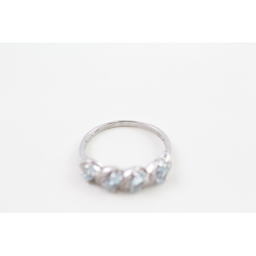 205 - 9ct white gold pear cut blue topaz & diamond half eternity ring (2.4g) Size  Q