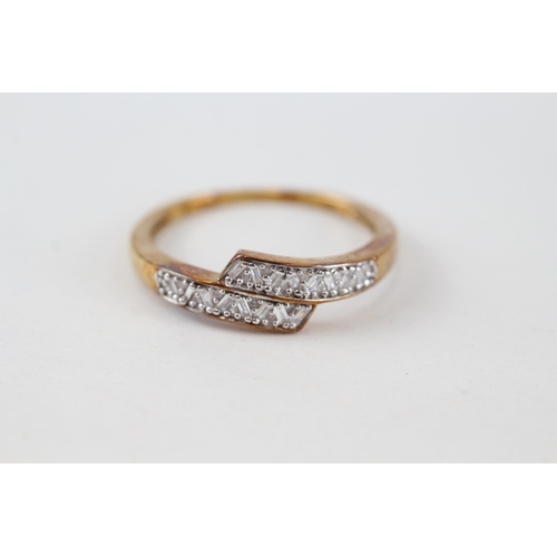 219 - 9ct gold vari-cut diamond bypass ring (2.4g) Size  S