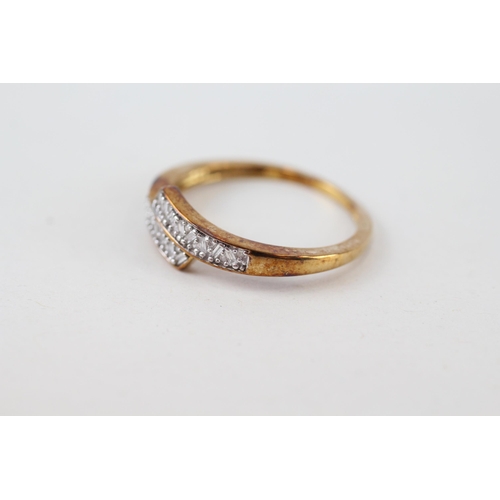 219 - 9ct gold vari-cut diamond bypass ring (2.4g) Size  S