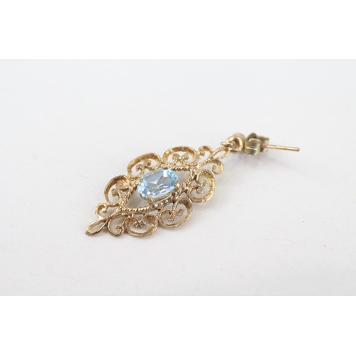 235 - 9ct gold blue topaz scroll patterned drop earrings with scroll backs (2.1g)