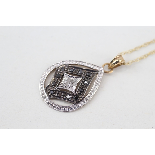 256 - 9ct gold diamond & black gemstone pendant necklace (2.3g)