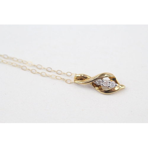 261 - 9ct gold diamond three stone pendant necklace (1g)