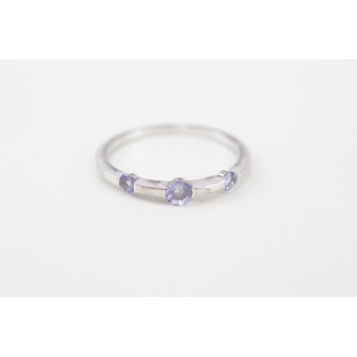 266 - 9ct gold tanzanite three stone ring (1.6g) Size  O