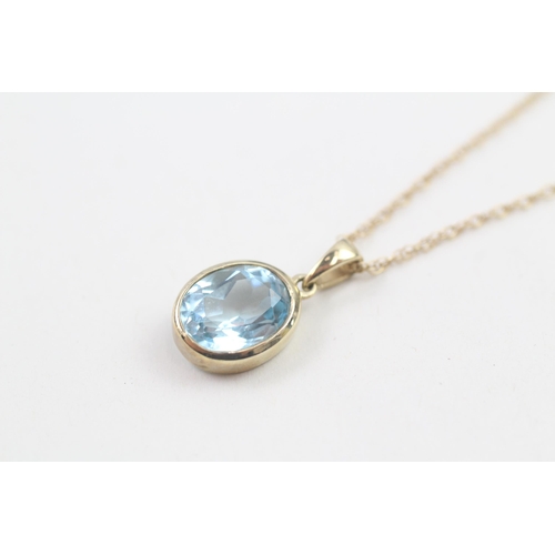 30 - 9ct gold oval cut blue topaz pendant necklace, bezel set (2.6g)