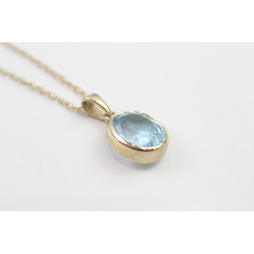 30 - 9ct gold oval cut blue topaz pendant necklace, bezel set (2.6g)