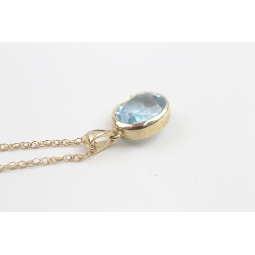 30 - 9ct gold oval cut blue topaz pendant necklace, bezel set (2.6g)