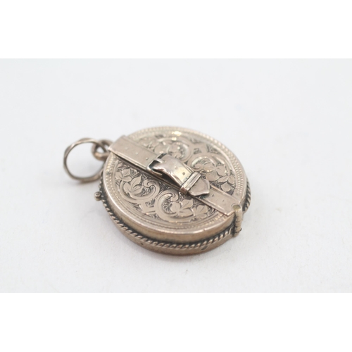 307 - 9ct gold antique pop out locket (5.6g)