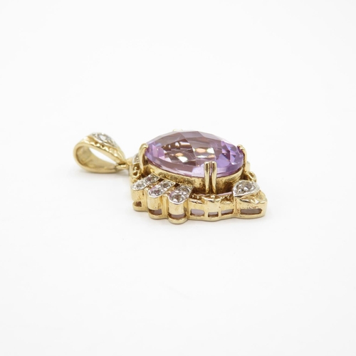 323 - HM 9ct gold pendant set with large purple amethyst with diamond surround  (9g)