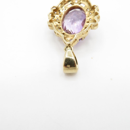 323 - HM 9ct gold pendant set with large purple amethyst with diamond surround  (9g)