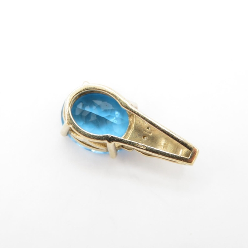 325 - HM 9ct gold pendant with blue paste stone (3.1g)