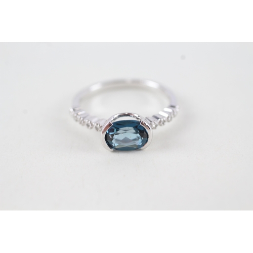 65 - 9ct gold oval cut blue topaz & diamond dress ring (2.5g) Size  N