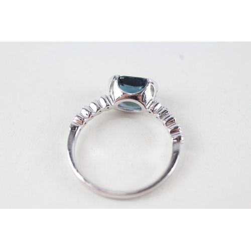 65 - 9ct gold oval cut blue topaz & diamond dress ring (2.5g) Size  N