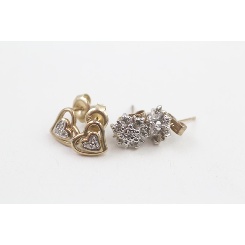 76 - 2 x 9ct gold diamond stud earrings (2.1g)