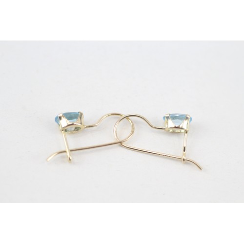 250 - 14ct gold topaz single stone earrings (0.7g)