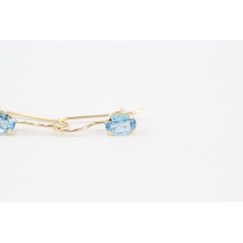 250 - 14ct gold topaz single stone earrings (0.7g)