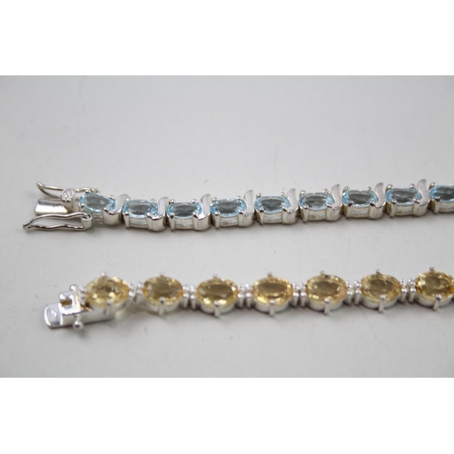 339 - Two silver gemstone tennis bracelets including Citrine (31g)