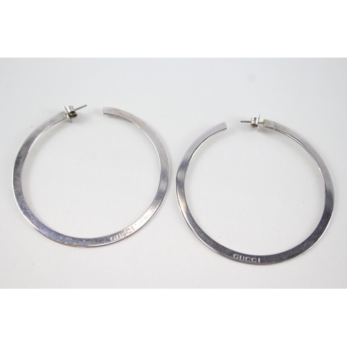 340 - Pair of silver hoop earrings by designer Gucci (15g)