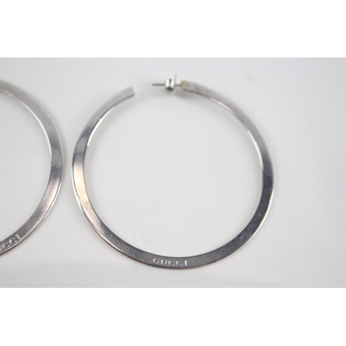 340 - Pair of silver hoop earrings by designer Gucci (15g)