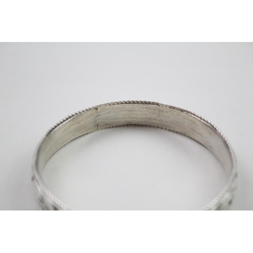 343 - Silver antique high relief bangle (69g)